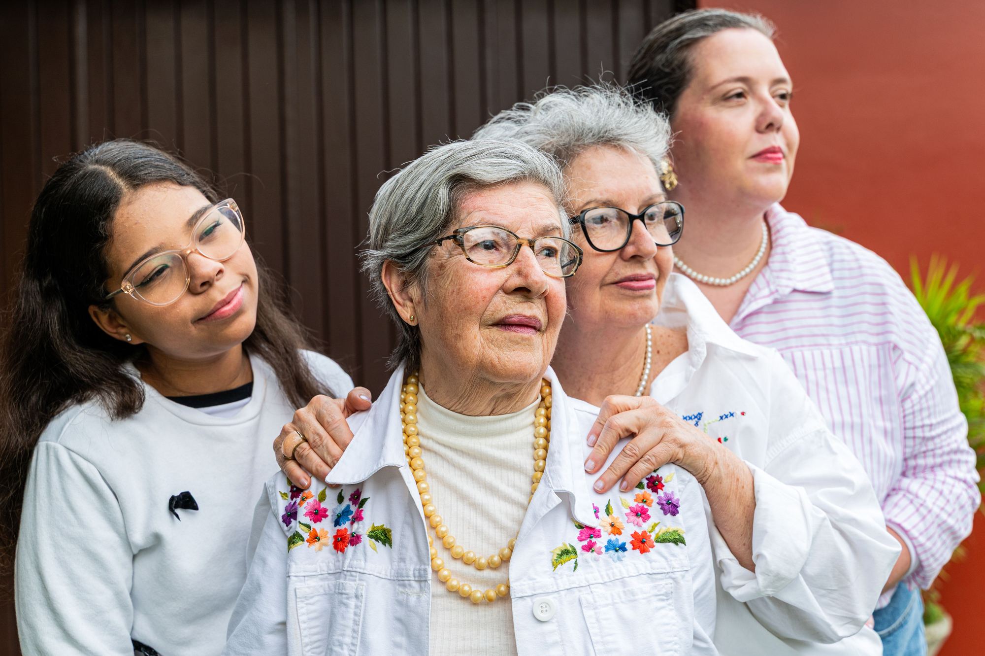 Three generations of a family standing together